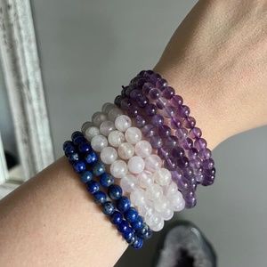 2 sodalite bracelets 2 rose quartz bracelets and 3 amethyst bracelets